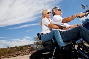 Couple on a motorcycle with motorcycle insurance in Webster, TX